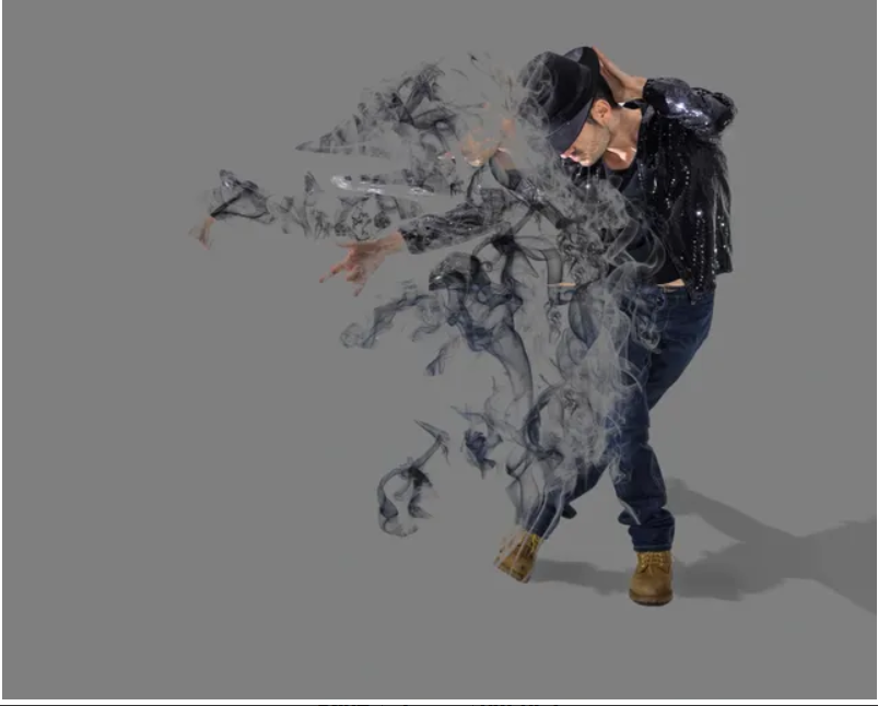 Dancer in hat with smoky dissolving effect