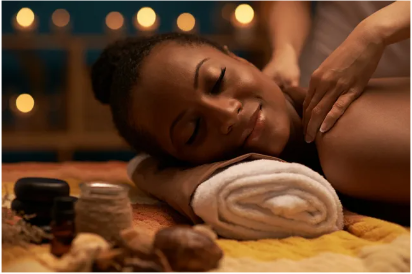 Person receiving relaxing shoulder massage at spa